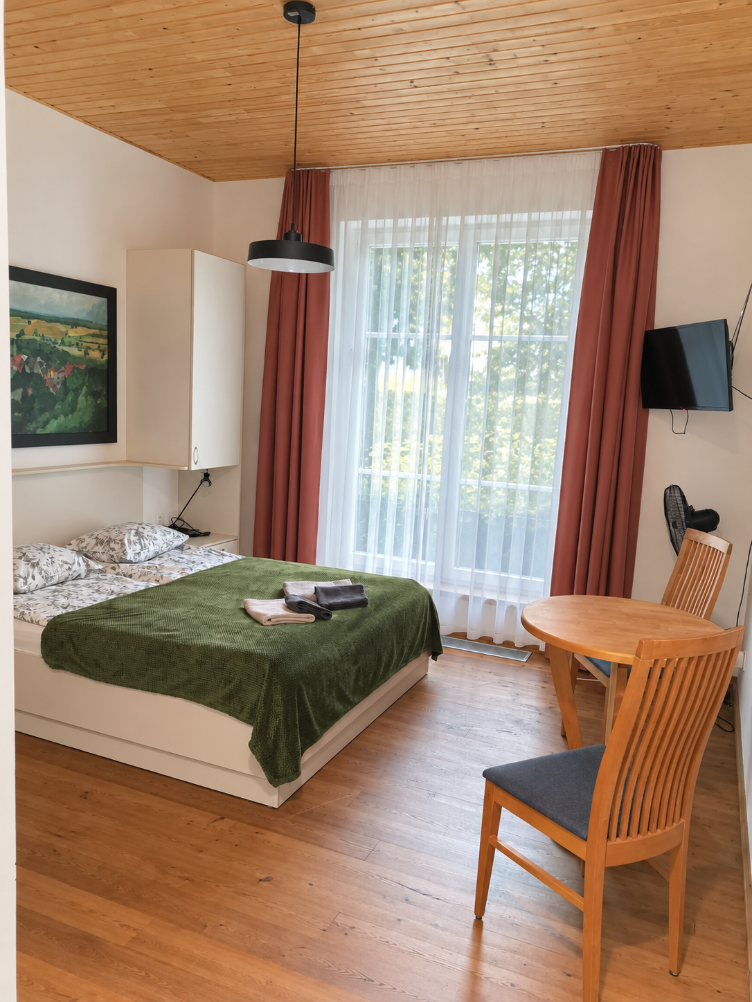 Double room at Aika – window and seating area